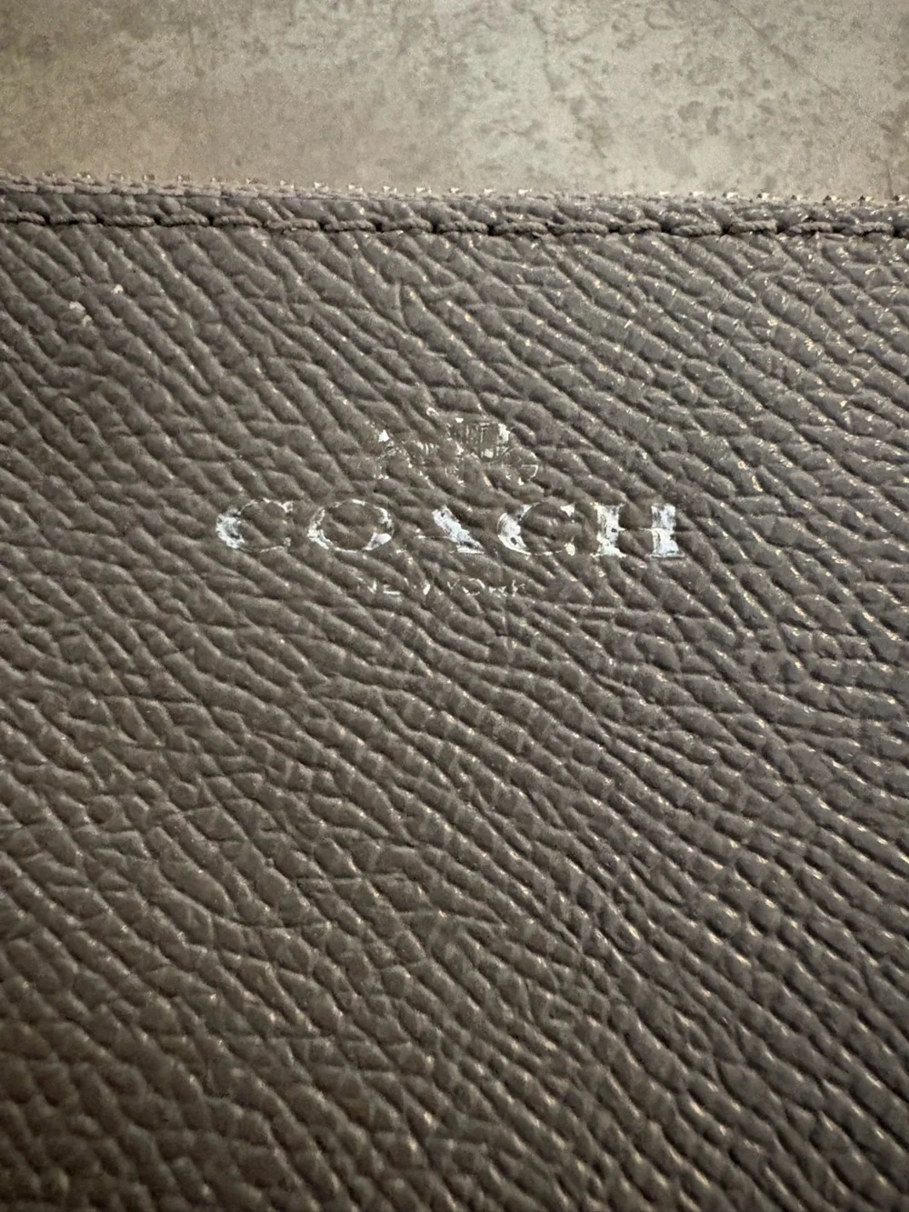 Coach Corner Zip wristlet in a metallic crossgrain leather